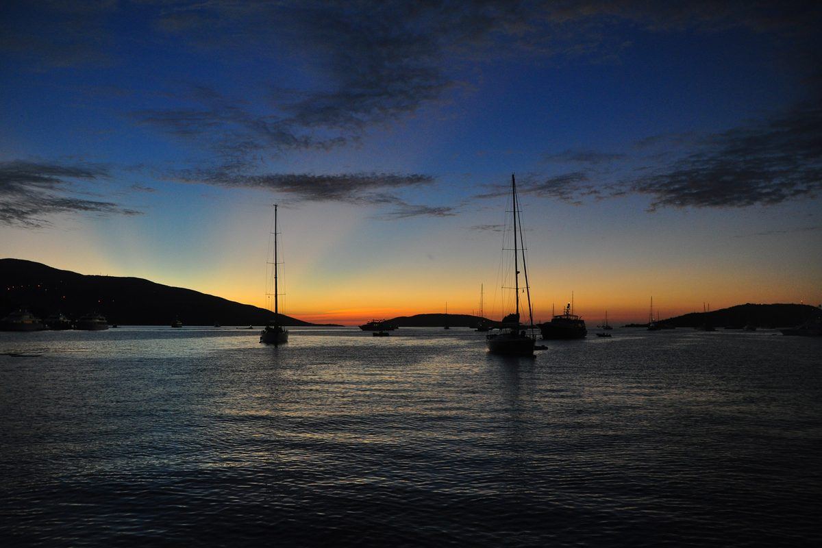Sailing yachts at anchor after sunset off the Bitter End Yacht Club, Virgin Gorda, British Virgin Islands