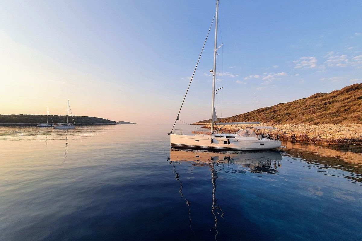 Sailing boat at dawn in the Pakleni Islands, off Hvar