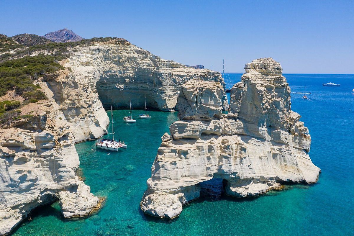 Sailing yachts at the Kleftiko sea caves, Milos